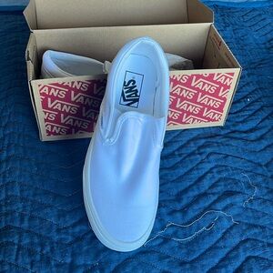 Never worn white slip on Vans size 8.5 woman / size 7 men’s